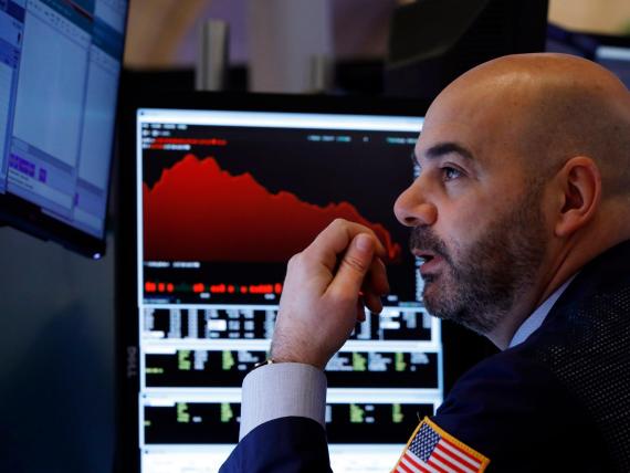 Trader Fred DeMarco works on the floor of the New York Stock Exchange, Friday, Feb. 28, 2020. Global stock markets are falling further on spreading virus fears. (AP Photo/Richard Drew)